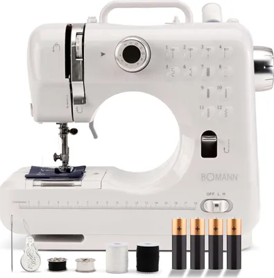 A white sewing machine with accessories.