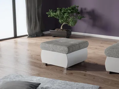A modern living room with a wooden floor, a large window with curtains, a bonsai tree, and two ottomans.