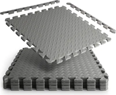 A stack of interlocking foam mats, with some loose pieces at the top.