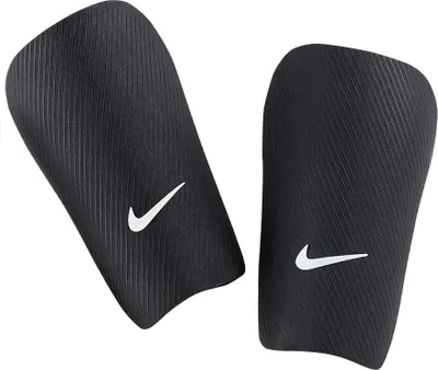 A pair of black Nike shin guards with white Nike logos.