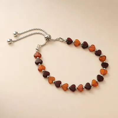 Produktbild von Bernstein Armband Herzen dunkel kirschrot und cognacfarben Damen, KI-generiertes Bild