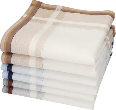 A stack of folded handkerchiefs with different colored borders.