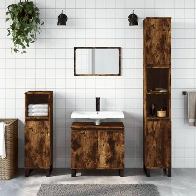 A bathroom vanity set with cabinets and a sink against a tiled wall.