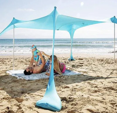 Produktbild von Unyqoos® Pop-up Strandzelt UPF50+ mit Sandschaufel, Erdnägeln & Stabilitätsstangen – UV‑Sonnenschutz für Camping, Angeln, Garten & Picknick (4 oder 8 Personen)