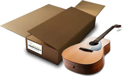 An opened cardboard box with a guitar next to it, suggesting the box is for shipping or storing a guitar.