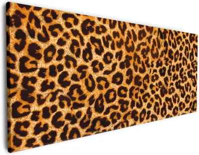 Produktbild von Wallario Premium Leinwandbild Leopardenmuster  in orange schwarz in Größe 50 x 125 cm