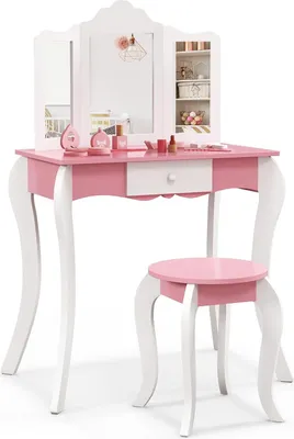A pink and white children's vanity table and stool set with a tri-fold mirror and toy makeup.