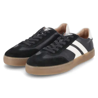 A pair of black and white sneakers with brown soles are shown against a white background.
