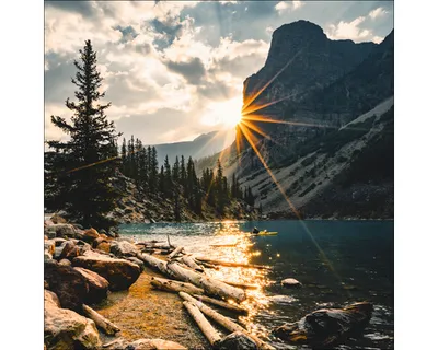 Produktbild von Glasbild Sonne am Bergsee 50x50 cm