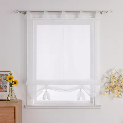 A white sheer Roman blind is shown hanging in a window.