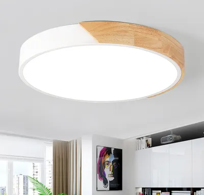 A modern LED ceiling light with a wood and white finish is shown mounted on a white ceiling.