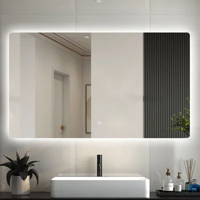 A modern bathroom vanity with a sink, faucet, and a large LED mirror above it.