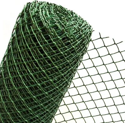 A roll of green plastic mesh fencing on a white background.