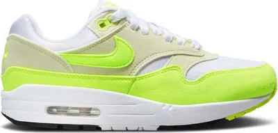 A side view of a Nike Air Max 1 '87 Volt Suede sneaker.