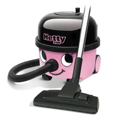 A pink and black Numatic Hetty cylinder vacuum cleaner with its hose and floor head.