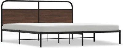 A metal bed frame with a wooden headboard and a white mattress.