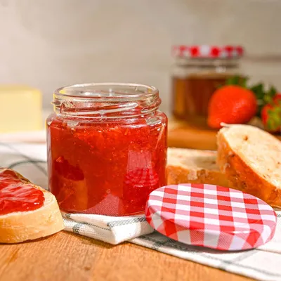 Produktbild von Einmachgläser mit Deckel 125 ml - Luftdicht - Spülmaschinenfest - Geschenk - 25 Marmeladengläser mit Etiketten & Stift