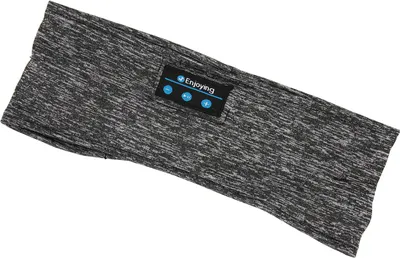 A close-up, angled view of a gray and black speckled fabric headband with a small black rectangular patch containing blue buttons and the word "Enjoying" printed on it.