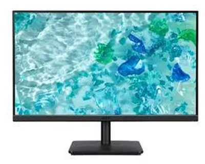A computer monitor displaying a colorful abstract image of water and blue and green shapes.