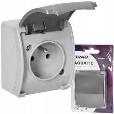 Imagen del producto de Enchufe individual para exteriores, marca Orno, grado de protección IP44, color gris, para montaje en superficie, con tapa
