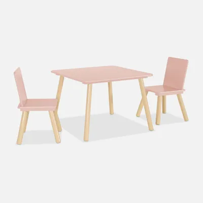 A pink children's table and two chairs with wooden legs are shown against a white background.