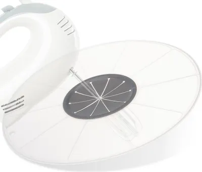 A close-up view of a hand mixer with a clear splash guard attached.