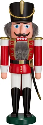 A traditional nutcracker soldier standing on a green base.