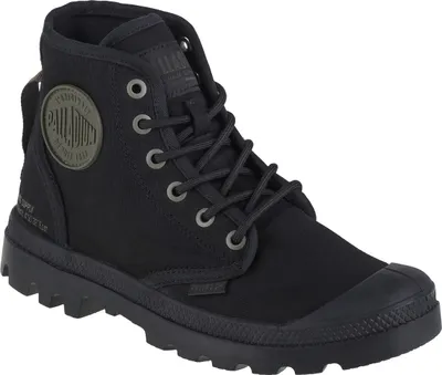 A studio shot of a single black Palladium boot.