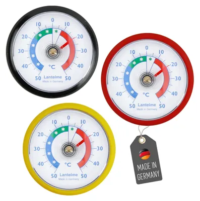 Three round thermometers in different colored casings (black, red, yellow) and a separate 'Made in Germany' tag are displayed against a white background.