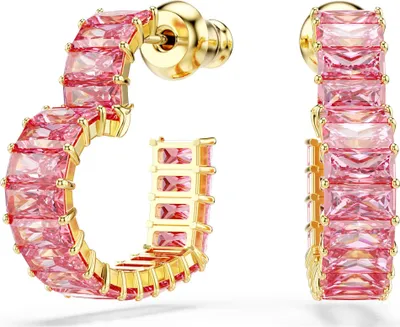 A pair of gold hoop earrings with pink baguette-cut stones.