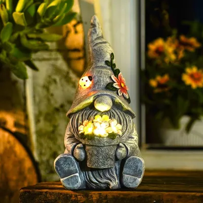 Immagine prodotto di Figurina da giardino seduta con vaso di fiori - Illuminazione LED solare - Resina - Decorazione da esterno