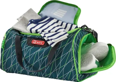 A sports bag filled with clothes and shoes.