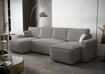 A modern living room with a large grey sectional sofa.