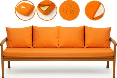 A set of orange outdoor sofa cushions on a wooden bench.