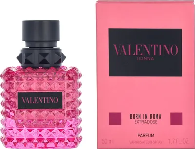 A bottle of Valentino Donna Born In Roma Extradose Eau de Parfum and its pink packaging are displayed side-by-side against a white background.