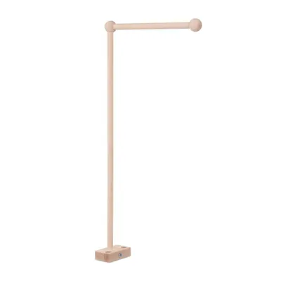 A wooden mobile holder for a baby crib.