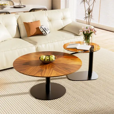 A living room scene with a sectional sofa, two coffee tables, and a rug.
