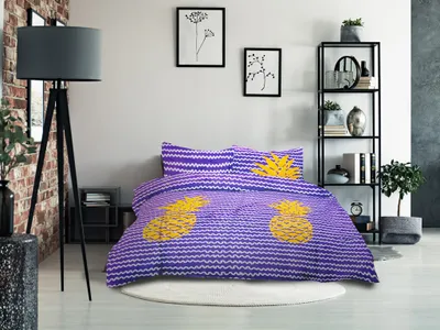 A bedroom scene with a bed dressed in purple and yellow pineapple-patterned bedding.