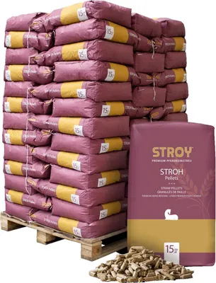 A large stack of bagged animal bedding pellets on a pallet, with a single bag and a pile of loose pellets in the foreground.