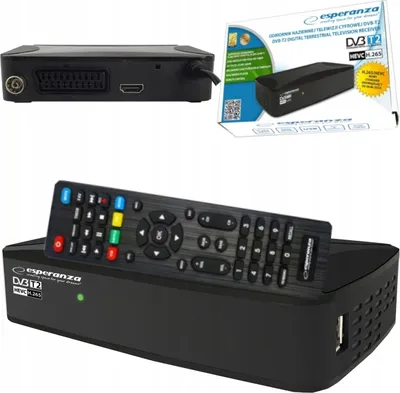 A black digital TV tuner and decoder with its remote control, presented on a white background. The product packaging is also visible in the upper right corner.