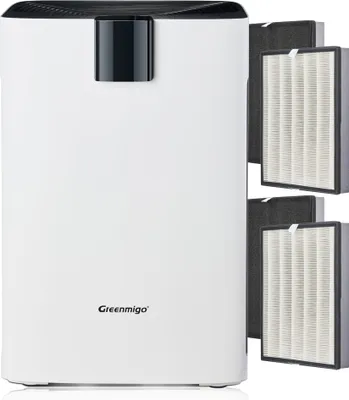 A white air purifier with a black top and a black accent piece on the front. Several replacement filters are shown to the right of the purifier.