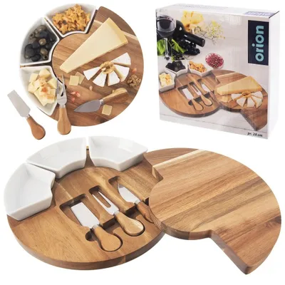 A cheese board set with serving bowls and knives, displayed with its packaging.