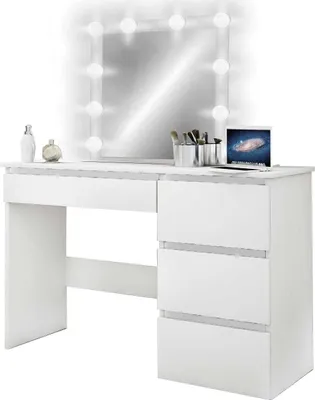 A white vanity table with a mirror and drawers, illuminated by light bulbs around the mirror.
