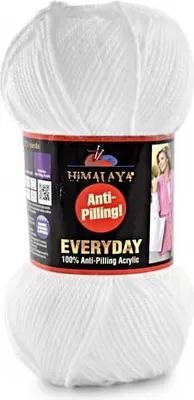 A ball of white yarn with a product label.
