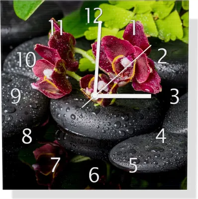 Produktbild von Wallario Design Wanduhr Dunkelrote Orchideen-Blüte auf schwarzen Steinen mit Regentropfen aus Aluverbund, Größe 30 x 30 cm