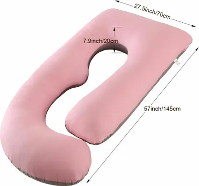 A pink U-shaped pregnancy pillow with dimensions indicated by measurement lines and text.