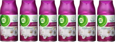 Six cans of Air Wick air freshener are lined up against a white background.