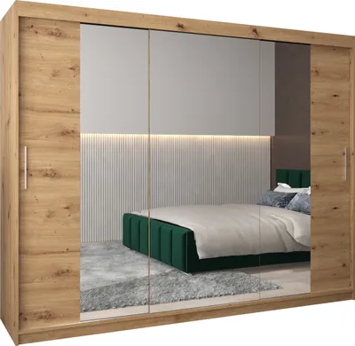 A bedroom scene reflected in a wardrobe with mirrored doors.
