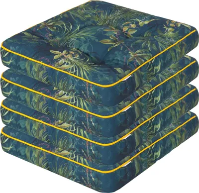 A stack of four square cushions with a tropical leaf pattern and yellow piping.
