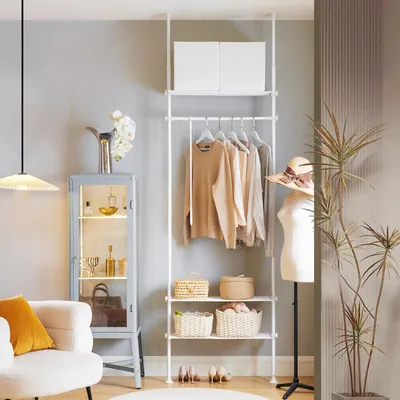 A well-organized bedroom or dressing area with a white telescoping clothing rack, a mannequin, a display cabinet, and a chair.